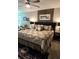 Inviting main bedroom featuring a comfortable bed, decorative headboard, and bedside tables at 3984 Maurice Ave, Odessa, FL 33556