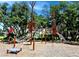 Community playground featuring a climbing structure and slide, providing a safe and engaging space for children to play at 3984 Maurice Ave, Odessa, FL 33556