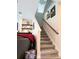 Carpeted staircase with wood railing leading to the upper level at 3984 Maurice Ave, Odessa, FL 33556