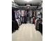Spacious walk-in closet featuring ample hanging space, shelving, and organized storage for clothes and accessories at 3984 Maurice Ave, Odessa, FL 33556