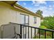 A balcony showcases a serene outdoor living space with plants and the sky in the background at 4114 Pinelake Ln # 202, Tampa, FL 33618