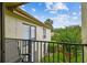 View from the balcony looking out at the lush and serene neighborhood at 4114 Pinelake Ln # 202, Tampa, FL 33618