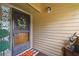 Inviting front entryway enhanced with a decorative wreath and a cheerful welcome mat at 4114 Pinelake Ln # 202, Tampa, FL 33618