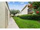 Cozy apartments feature lush landscaping and a well-maintained walkway at 4114 Pinelake Ln # 202, Tampa, FL 33618