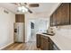 Modern kitchen featuring stainless steel appliances, dark wood cabinets, and a seamless design at 4114 Pinelake Ln # 202, Tampa, FL 33618