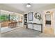 Spacious living room featuring stylish furnishings, a console table, and seamlessly connected dining and kitchen areas at 4114 Pinelake Ln # 202, Tampa, FL 33618