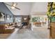 Open-concept living room boasts a cozy fireplace, plush seating, and a bright dining area at 4114 Pinelake Ln # 202, Tampa, FL 33618