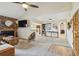 Open-concept living room with brick fireplace, and views to kitchen at 4114 Pinelake Ln # 202, Tampa, FL 33618