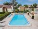 A bright pool area with lounge chairs, and an adjacent waterway makes this the perfect community gathering spot at 4114 Pinelake Ln # 202, Tampa, FL 33618