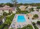Condo community offers residents a pool with seating, green spaces, and a tranquil pond at 4114 Pinelake Ln # 202, Tampa, FL 33618