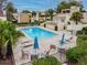 Community pool with lounge chairs and tables, perfect for relaxation and enjoying the Florida sunshine at 4114 Pinelake Ln # 202, Tampa, FL 33618