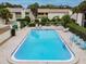 Community pool and deck with lounge chairs for relaxing in the Florida sunshine at 4114 Pinelake Ln # 202, Tampa, FL 33618