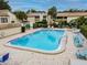Community pool with lounge chairs and seating, perfect for enjoying sunny Florida days at 4114 Pinelake Ln # 202, Tampa, FL 33618