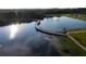 Scenic water view showcasing the tranquil lake with a wooden bridge, surrounded by lush greenery and walking trails at 4114 Pinelake Ln # 202, Tampa, FL 33618