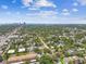 Gorgeous aerial view of the neighborhood with tree-lined streets, city skyline and glimpses of the ocean at 483 32Nd N Ave, St Petersburg, FL 33704