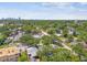 A beautiful aerial view of the neighborhood showing mature trees and the city skyline in the distance at 483 32Nd N Ave, St Petersburg, FL 33704