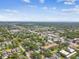 An attractive aerial view capturing the serene neighborhood, picturesque streets, and distant ocean horizon at 483 32Nd N Ave, St Petersburg, FL 33704