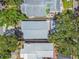 An aerial view of a roof and backyard featuring mature trees at 483 32Nd N Ave, St Petersburg, FL 33704