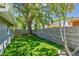 Secluded backyard with green turf and wooden fence offers a tranquil outdoor space at 483 32Nd N Ave, St Petersburg, FL 33704
