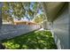 Backyard offers green turf and a wooden fence creating a great outdoor space at 483 32Nd N Ave, St Petersburg, FL 33704