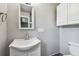 Neutral bathroom features a white vanity with a modern faucet and white cabinets at 483 32Nd N Ave, St Petersburg, FL 33704