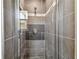 Beautiful gray tiled shower with glass door and window for natural light at 483 32Nd N Ave, St Petersburg, FL 33704