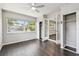 Light-filled bedroom showcasing wood floors, dual closets, and large windows at 483 32Nd N Ave, St Petersburg, FL 33704