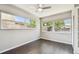 Cozy bedroom filled with natural light featuring wood floors and dual windows at 483 32Nd N Ave, St Petersburg, FL 33704