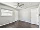 Bedroom with dark wood floors, a ceiling fan, and a door to the backyard at 483 32Nd N Ave, St Petersburg, FL 33704