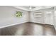 This bedroom has wood floors, two windows, and a door to the outside at 483 32Nd N Ave, St Petersburg, FL 33704