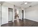 Open bedroom with a ceiling fan, view into the kitchen, and closet with sliding doors at 483 32Nd N Ave, St Petersburg, FL 33704