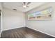 Neutral bedroom with wood floors, a ceiling fan and large windows that allow for an abundance of natural light at 483 32Nd N Ave, St Petersburg, FL 33704