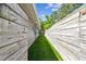 Home exterior showcasing a side yard featuring a wooden fence and astroturf at 483 32Nd N Ave, St Petersburg, FL 33704