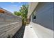 Home exterior showcasing a walkway alongside the house featuring a wooden fence and rock garden at 483 32Nd N Ave, St Petersburg, FL 33704