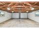 Spacious two car garage features an exposed rafter ceiling and bright lighting at 483 32Nd N Ave, St Petersburg, FL 33704