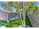 Rear view of a detached gray garage with white trim and green lawn at 483 32Nd N Ave, St Petersburg, FL 33704