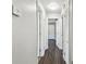 Hallway with white doors, trim, and light fixtures at 483 32Nd N Ave, St Petersburg, FL 33704
