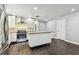 Bright kitchen with stainless steel appliances, a white island, and plenty of cabinet space at 483 32Nd N Ave, St Petersburg, FL 33704