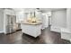 Modern kitchen with stainless steel appliances, white cabinets, and butcher block countertops on the island at 483 32Nd N Ave, St Petersburg, FL 33704