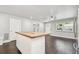 Spacious open-concept kitchen and living room area with dark wood floors and plenty of natural light at 483 32Nd N Ave, St Petersburg, FL 33704