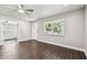 Inviting living room featuring dark wood flooring and natural light from the exterior window at 483 32Nd N Ave, St Petersburg, FL 33704
