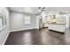 Bright living room featuring modern, minimalist design with hardwood floors, stainless appliances and island at 483 32Nd N Ave, St Petersburg, FL 33704