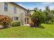 Backyard view showcasing landscaping, balcony and exterior elevation at 501 E Bay Dr # 802, Largo, FL 33770