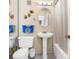Bathroom with pedestal sink, tub-shower combination, and decorative accents at 501 E Bay Dr # 802, Largo, FL 33770