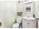 Half bath with vanity, framed mirror, and toilet at 501 E Bay Dr # 802, Largo, FL 33770