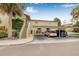 Charming condo building featuring covered parking, well-maintained landscaping, and inviting stairways at 501 E Bay Dr # 802, Largo, FL 33770