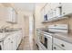 Efficient kitchen layout featuring appliances, ample cabinet storage, and tiled flooring at 501 E Bay Dr # 802, Largo, FL 33770