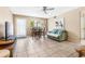 The neutral living room features tile flooring and a dining area in a naturally lit space at 501 E Bay Dr # 802, Largo, FL 33770