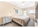 Bright main bedroom with neutral tones, ceiling fan, and walkout access at 501 E Bay Dr # 802, Largo, FL 33770