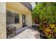 Private patio with tile flooring and lush landscaping perfect for relaxing at 501 E Bay Dr # 802, Largo, FL 33770